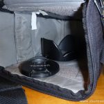 Empty camera case, lens cap and hood