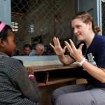 Project HOPE volunteer plays with a Cambodian girl